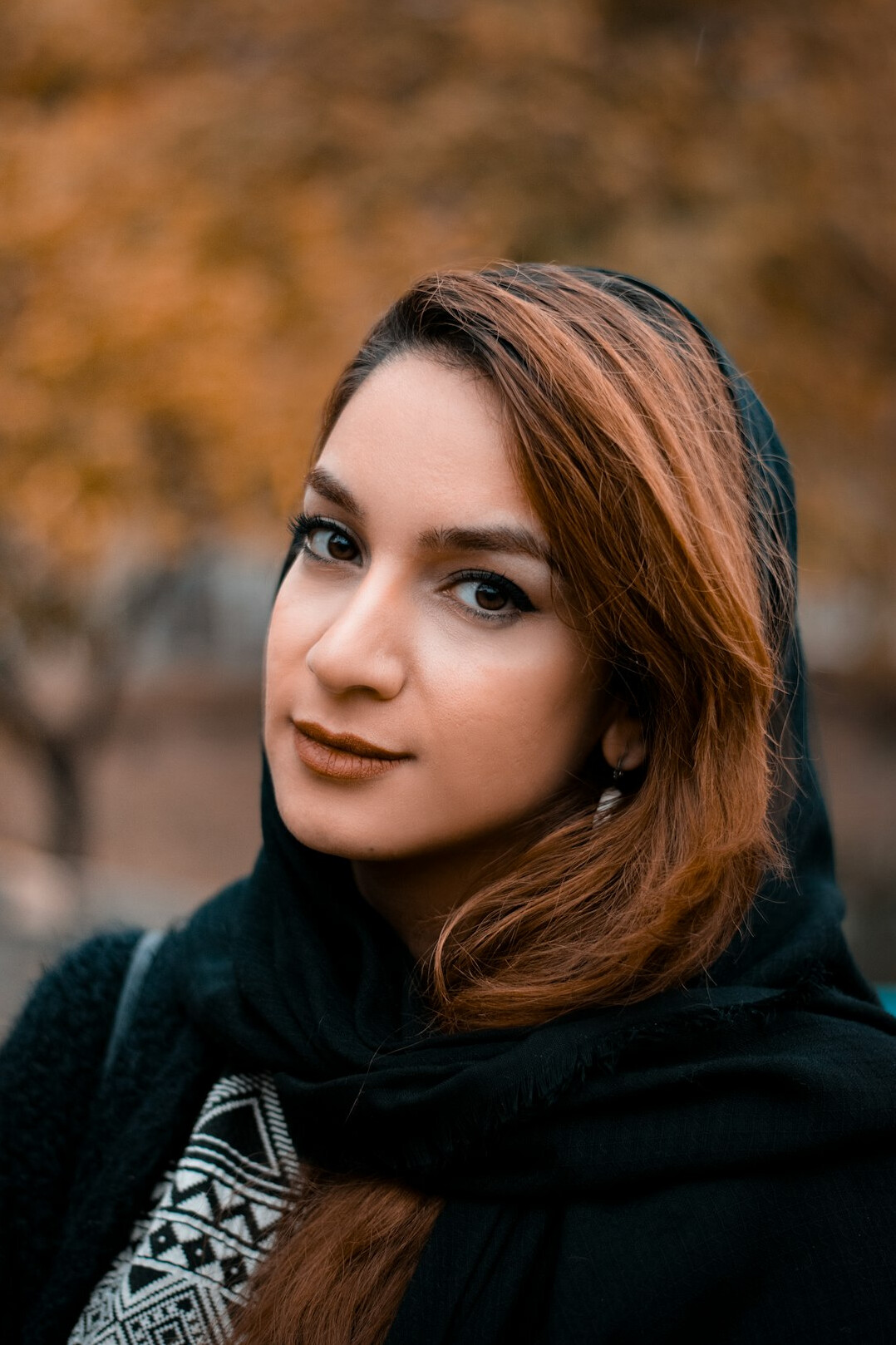 Portrait of a young woman with a warm smile