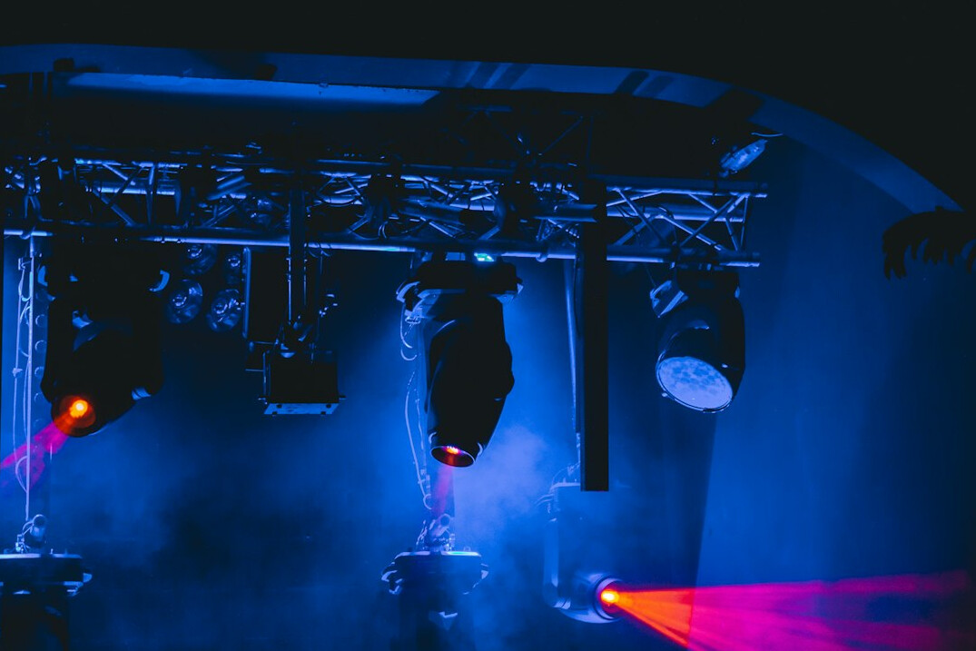 Studio lighting rig above a television set