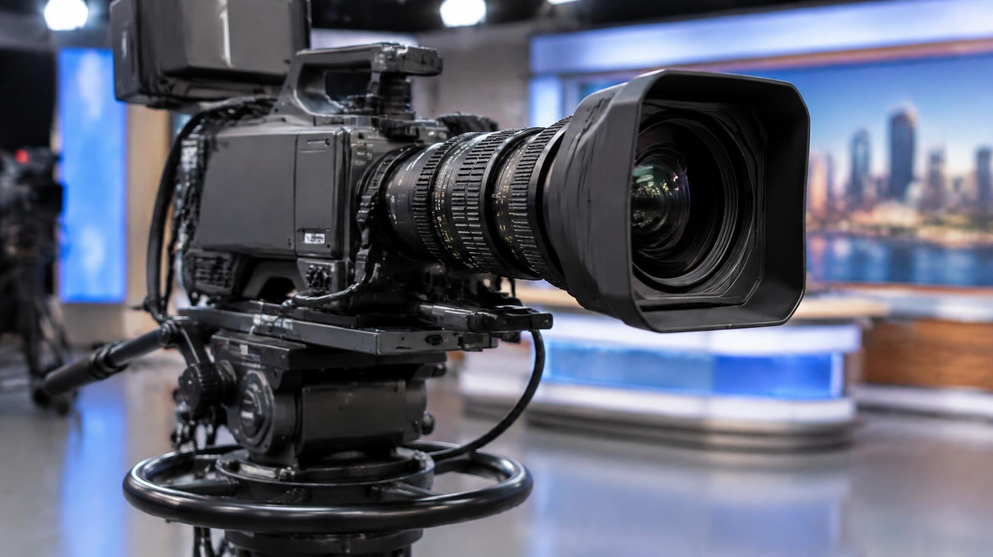Professional camera with large lens on a studio set